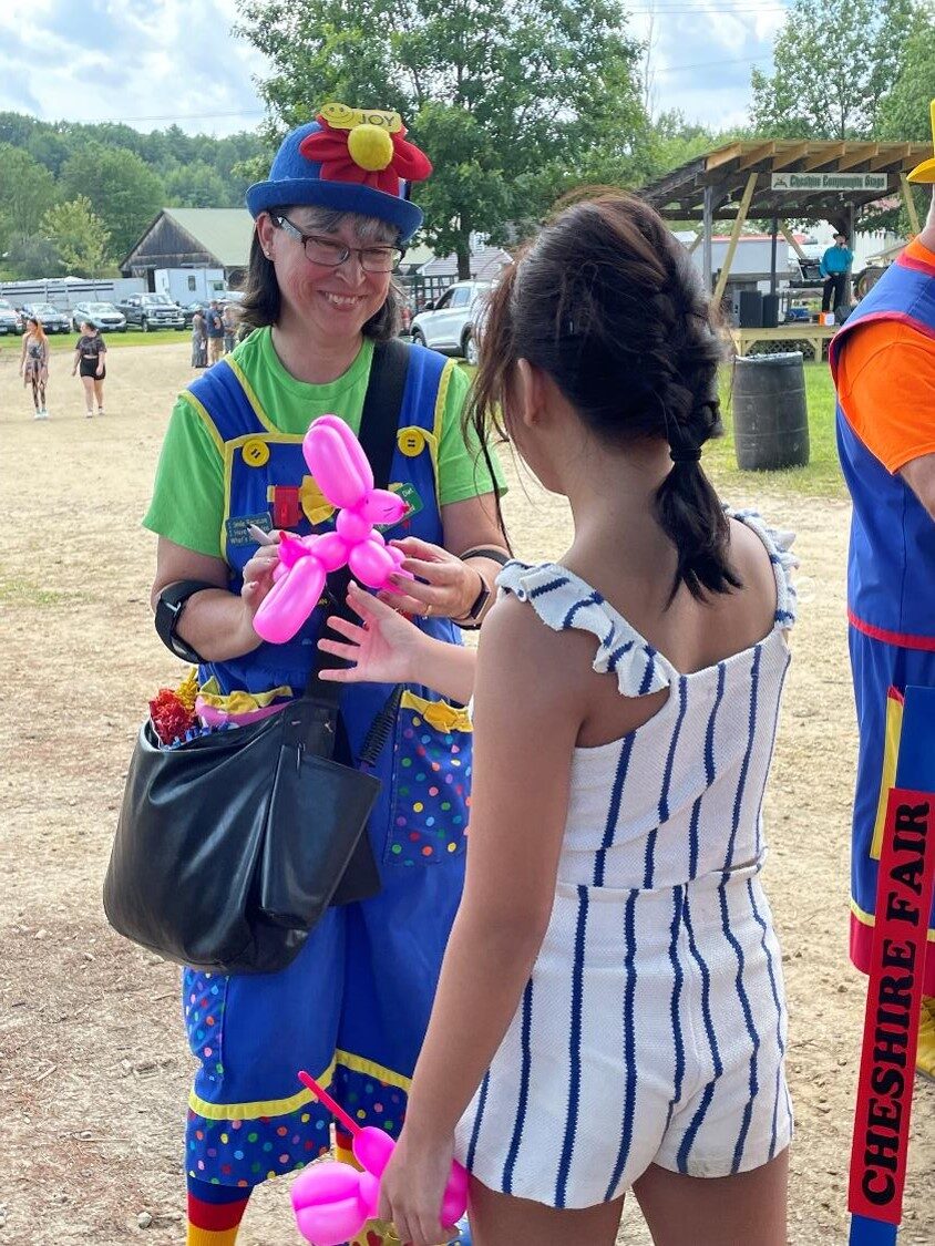 Balloon twisting in progress at an event