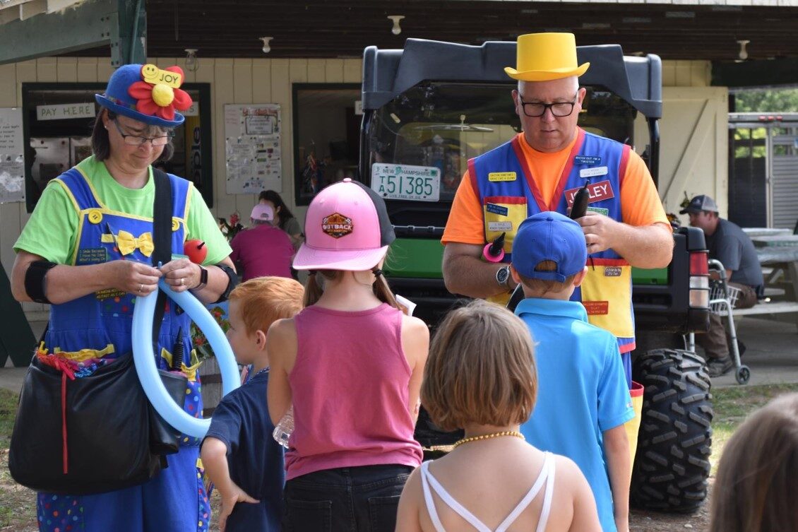 Lewy and his wife twisting balloon animals together